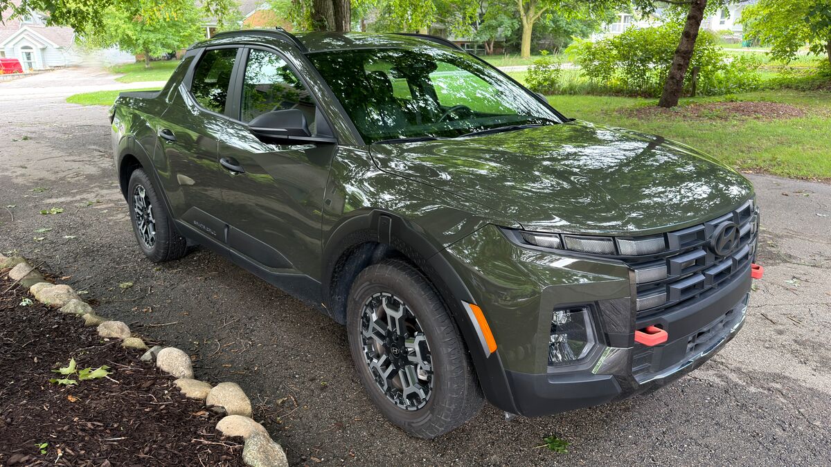 2026 Hyundai Santa Cruz parked on a street by trees.