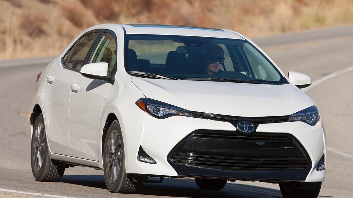 2018 Toyota Corolla parked on the side of a road.