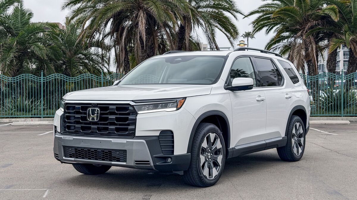 2026 Honda Pilot in white parked near palm trees.