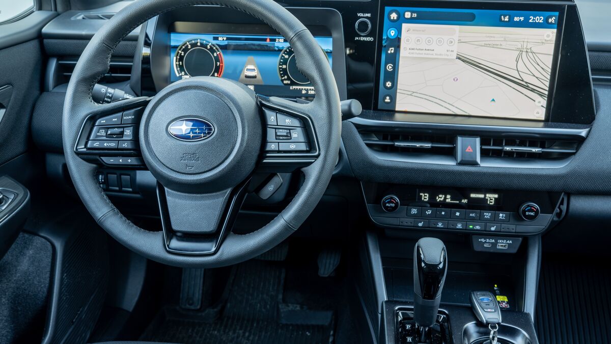 2026 Subaru Outback Wilderness interior shot of the front steering wheel and the driver's controls, including the instrument and multimedia screens.