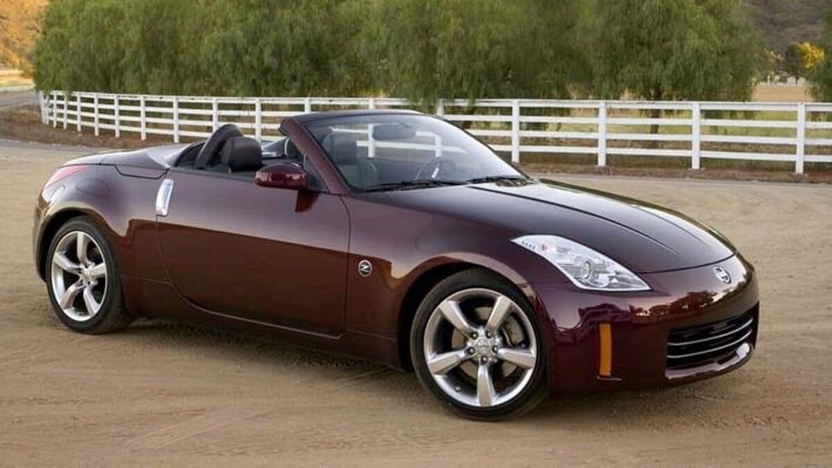 2006 Nissan 350Z Convertible parked by a barn.