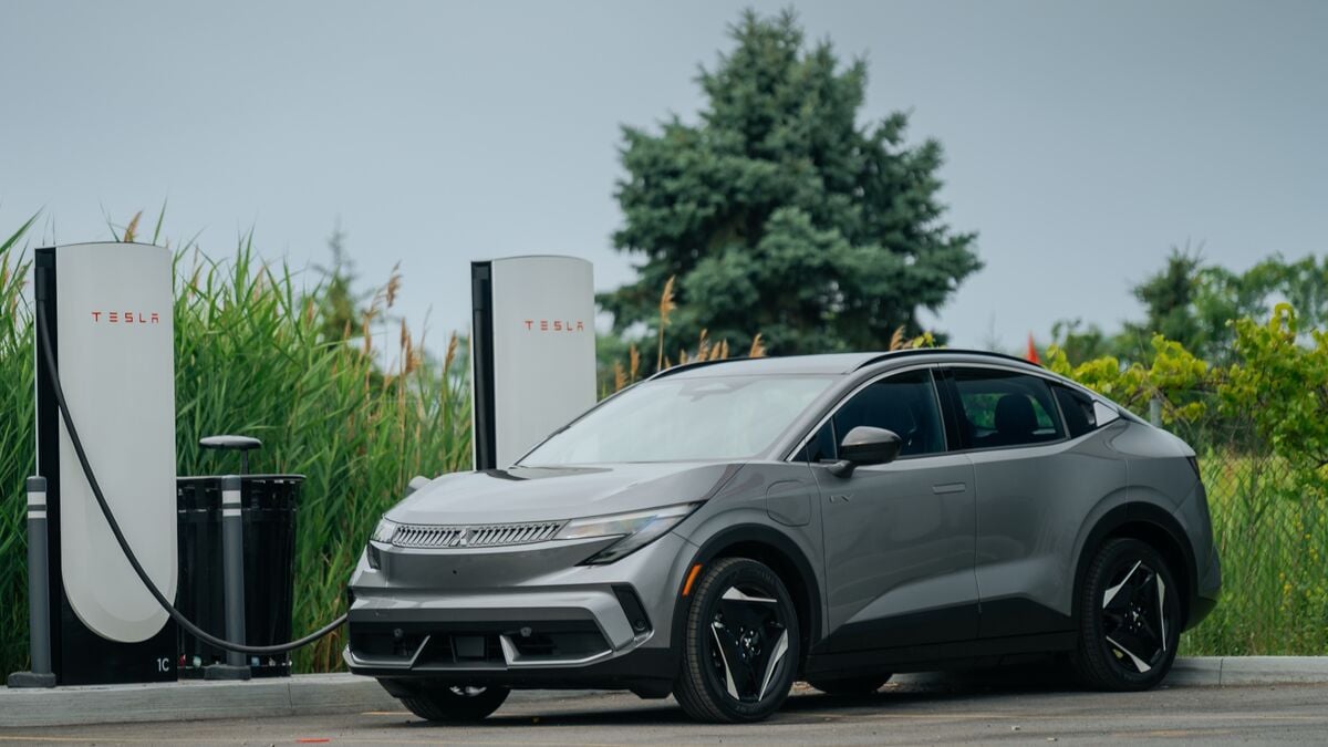 2027 Mitsubishi Eclipse Sportback EV 2 at a charging station.