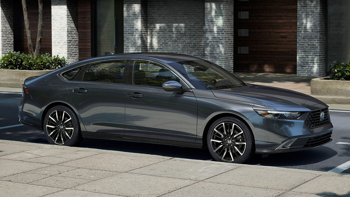2024 Honda Accord in charcoal grey parked by a building.