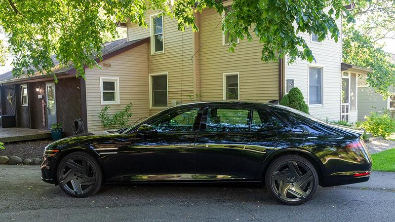 2026 Genesis G90 3.5T E-SC MHEV Prestige Black AWD in a suburban driveway