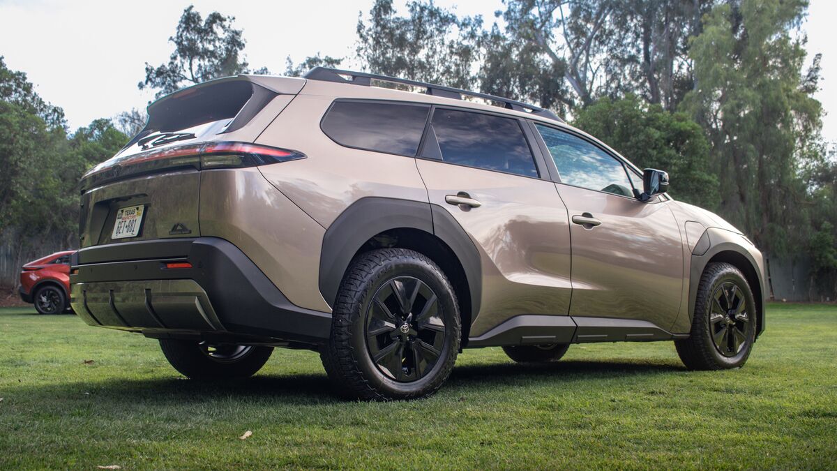 2026 bZ Woodland rear three quarter viewparked on grass.