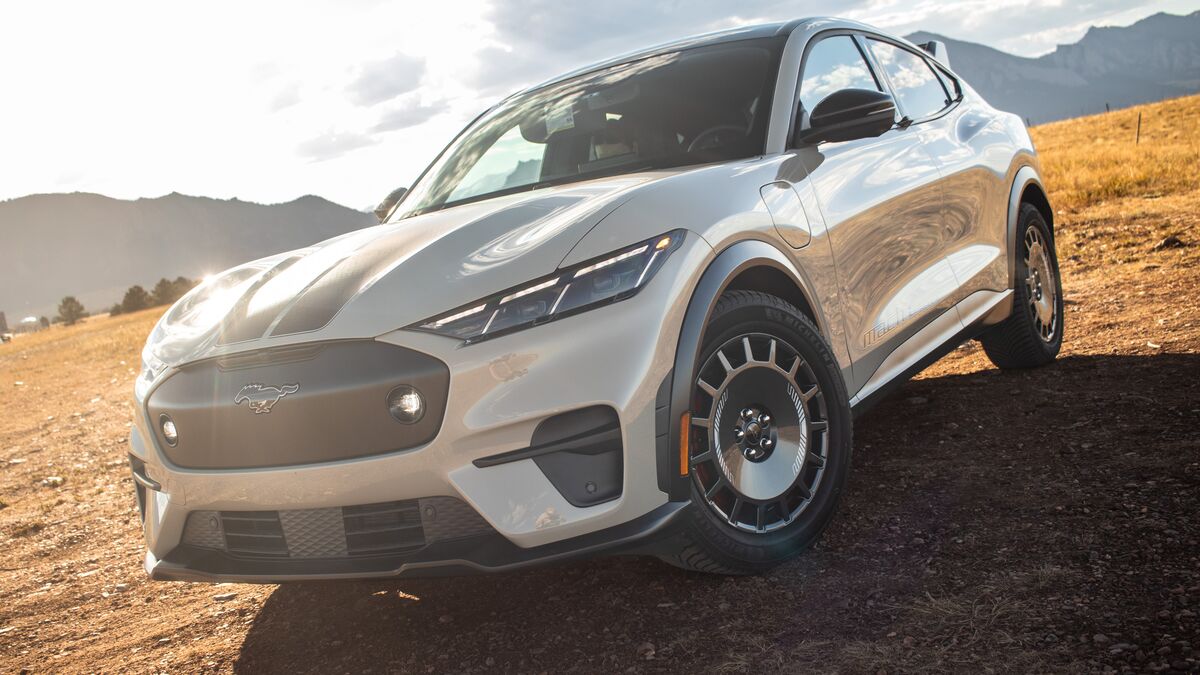 2026 Ford Mustang Mach-E Rally front 3 quarter angled by mountains.