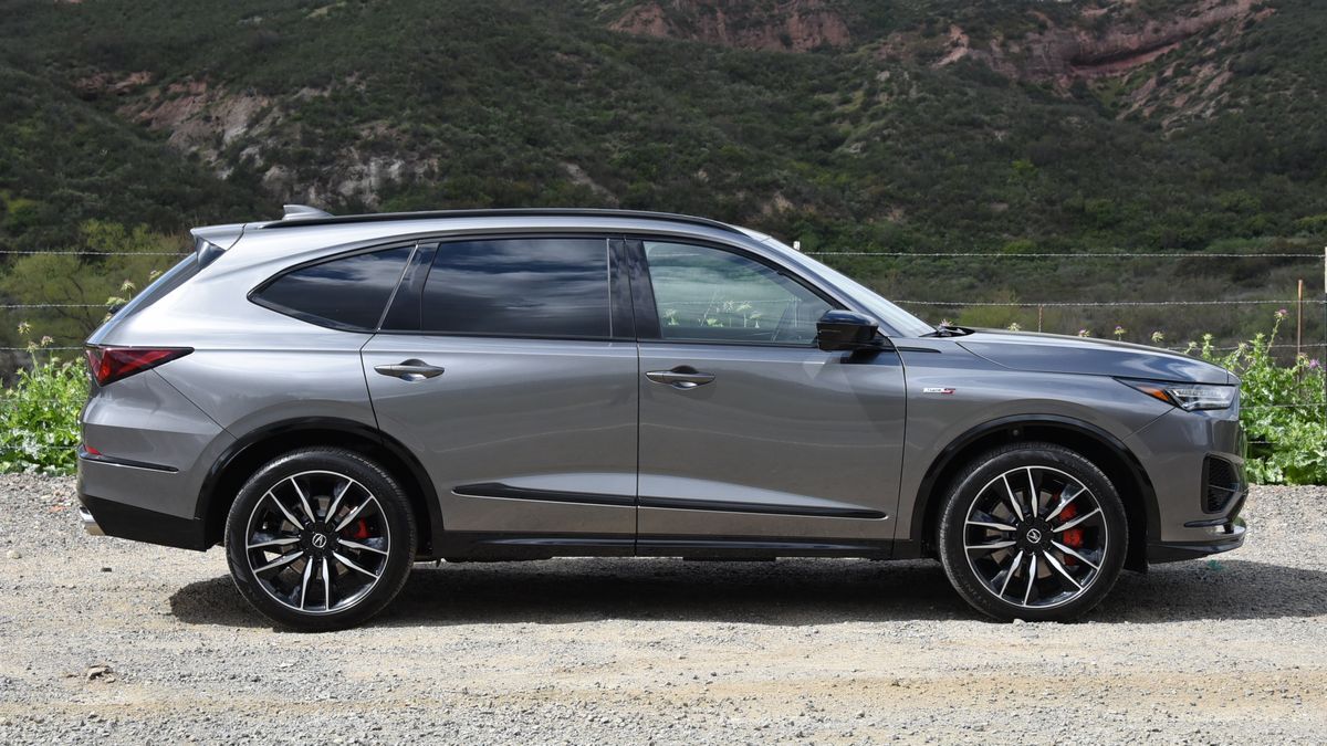 2024 Acura MDX Type S in grey with hills in the background.