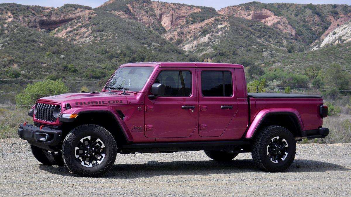 2025 Jeep Gladiator Rubicon parked on a dirt road with red hills in the backgound.