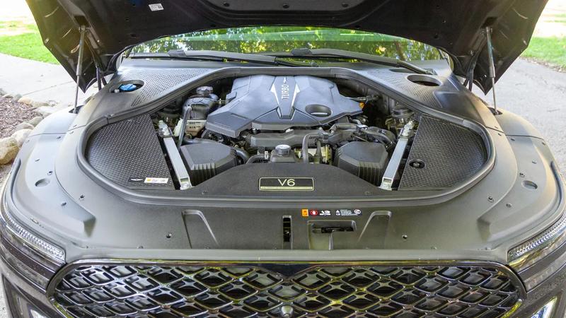 2026 Genesis G90 3.5T E-SC MHEV Prestige Black AWD in a suburban driveway