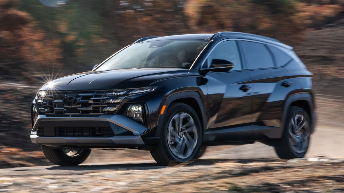 2026 Hyundai Tucson Hybrid driving on a dirt road.
