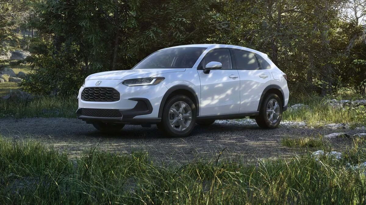 2027 Honda HR-V LX Platinum White Pearl in the woods.
