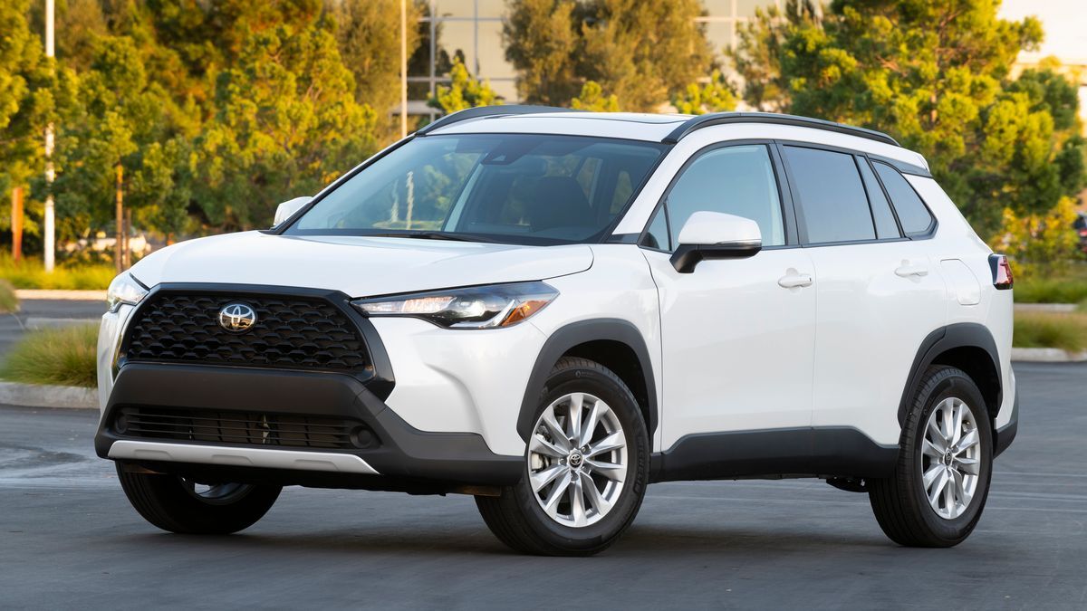 2025 Toyota Corolla Cross parked in front of an office building.