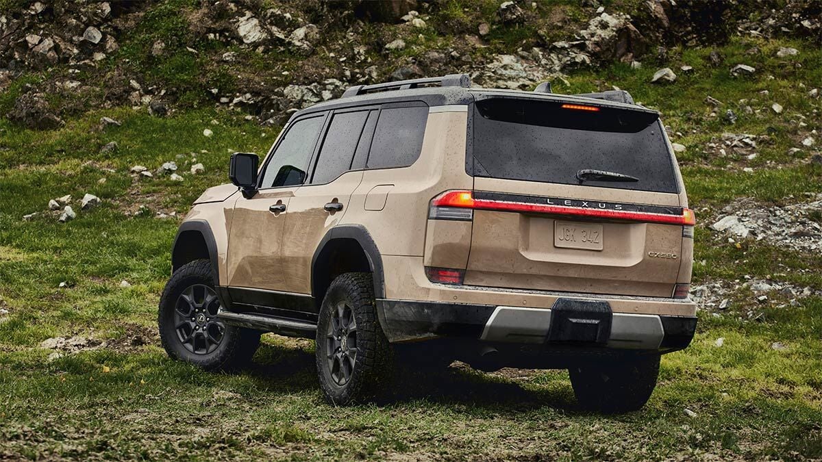 2024 Lexus GX Parked on a grassy hill with rock outcropping.