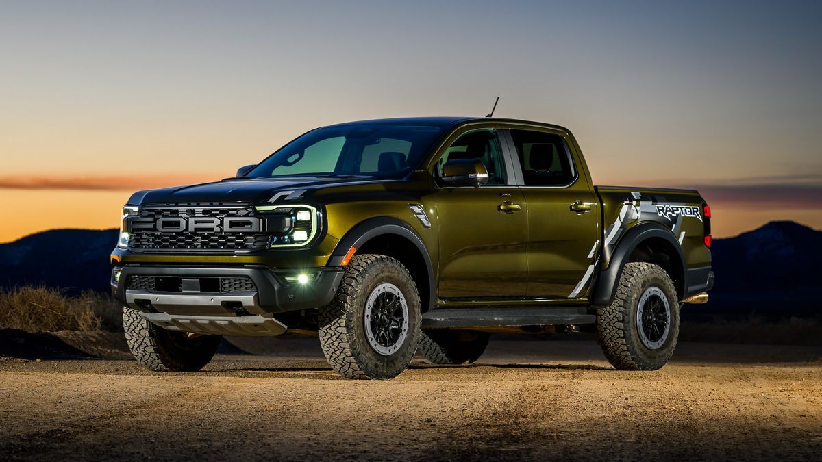 2025 Ford Ranger Raptor off-roading on a trail with mountains in the background.