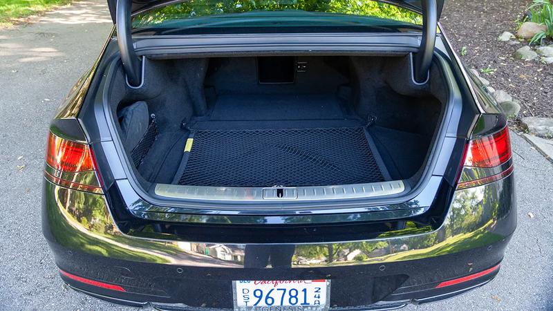 2026 Genesis G90 3.5T E-SC MHEV Prestige Black AWD in a suburban driveway