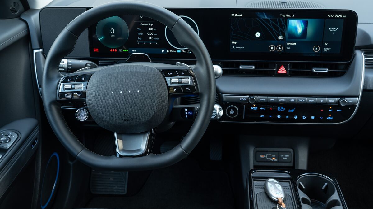A detailed interior photo of the driver's controls of the Hyundai Ioniq 5.