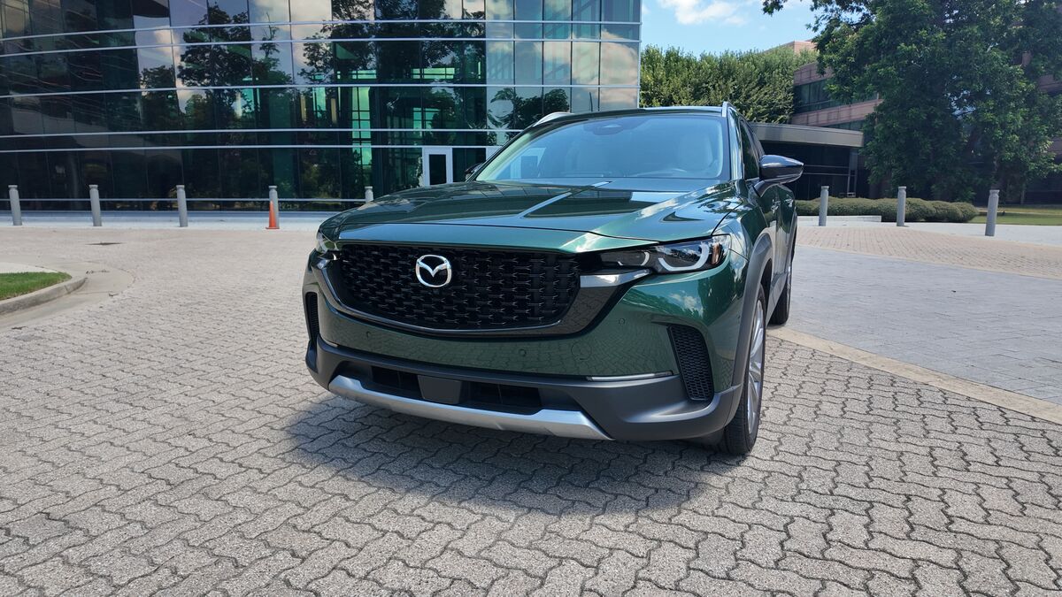 2026 Mazda CX-50 parked by a building.