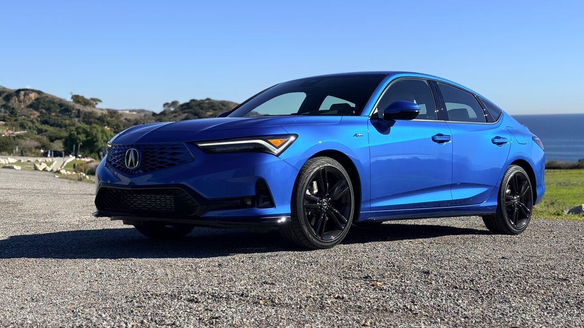 2026 Acura Integra on the shore, front 3/4 left view.