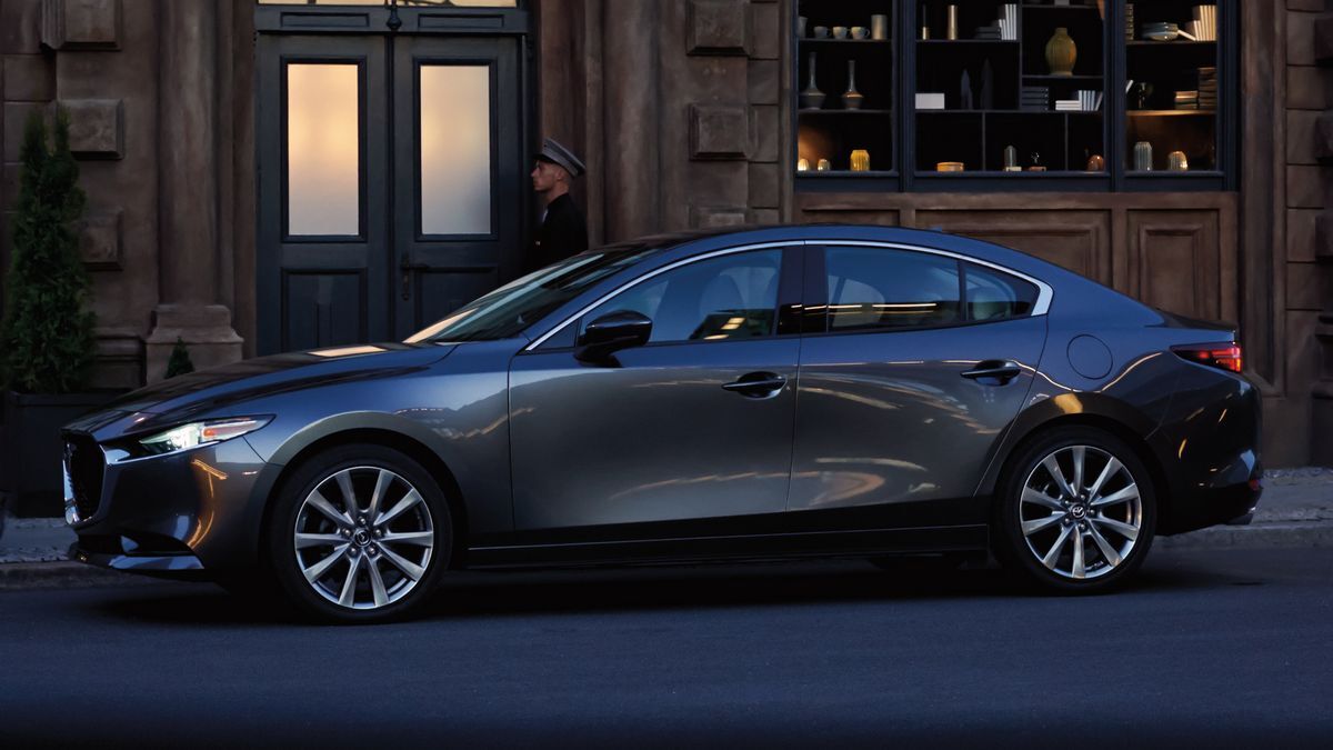 2025 Mazda3 Sedan parked by a building.