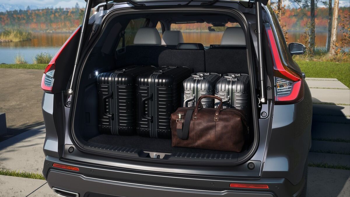 Photo of 2026 Honda CR-V from the back with its rear hatch open and loaded with cargo against an outdoor backdrop