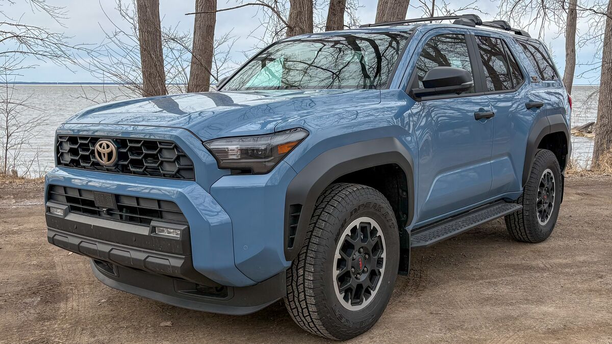 2025 Toyota 4Runner TRD-Off-Road parked in gravel lot by the water.