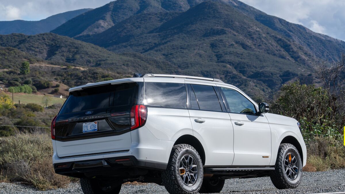 Rear 3/4 view of a 2025 Ford Expedition Tremor parked in SIlverado Canyon on a sunny day