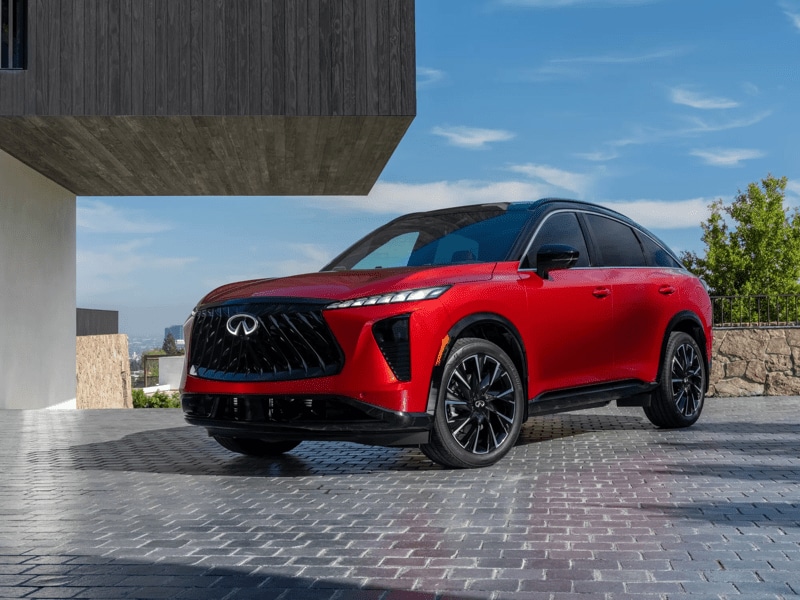 Front quarter view of 2027 Infiniti QX65 in Sunfire Red
