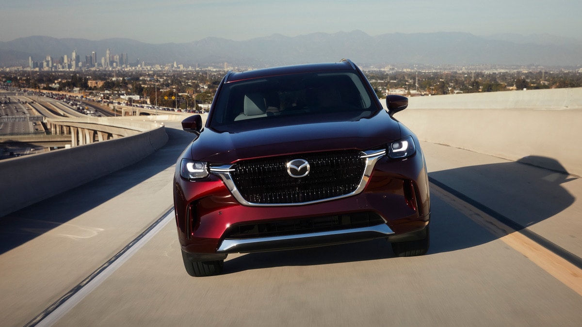 2024 Mazda CX-90 front view with LA in background.