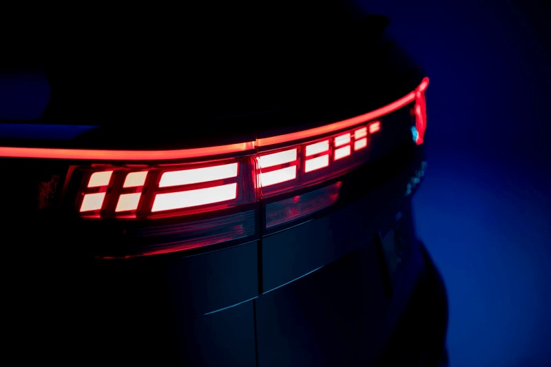 Rear brake lighting from the 2027 Volkswagen Atlas in a dark room with a blue background