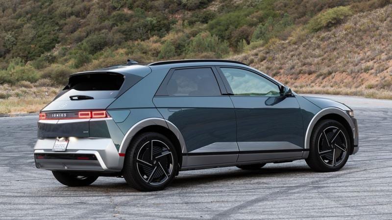 2025 Hyundai IONIQ 5 on a mountain road at sunrise.