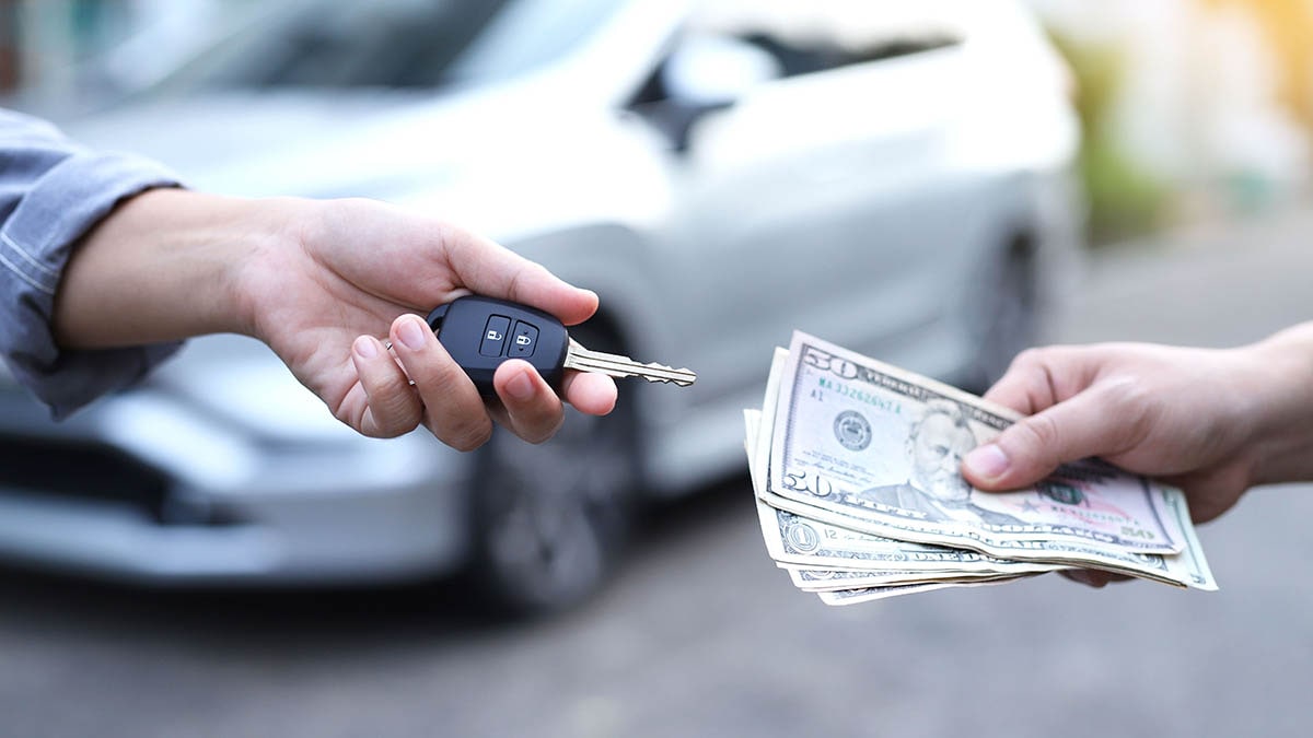 Exchanging cash for car keys