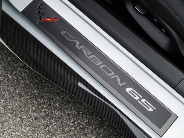 Exclusive Carbon 65 sill plates greet driver and passenger.