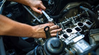 A mechanic making a car repair