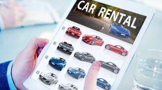 Hands Holding Digital Tablet Car Rental
