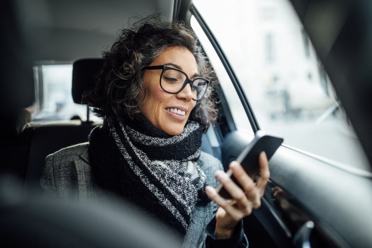 Woman filling out customer service survey on phone