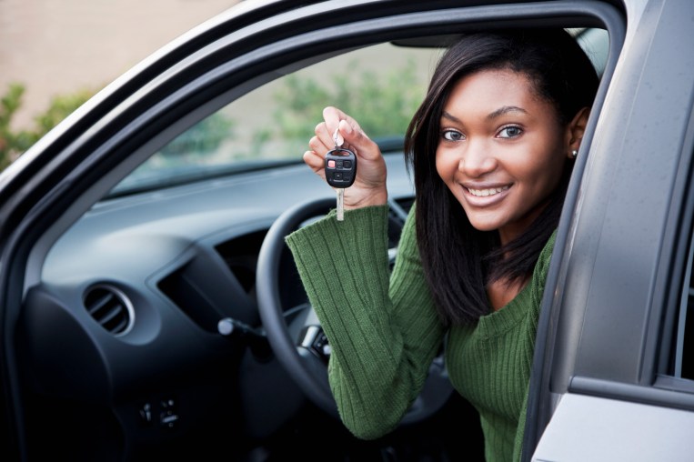 Young Driver Holding Up Car Key