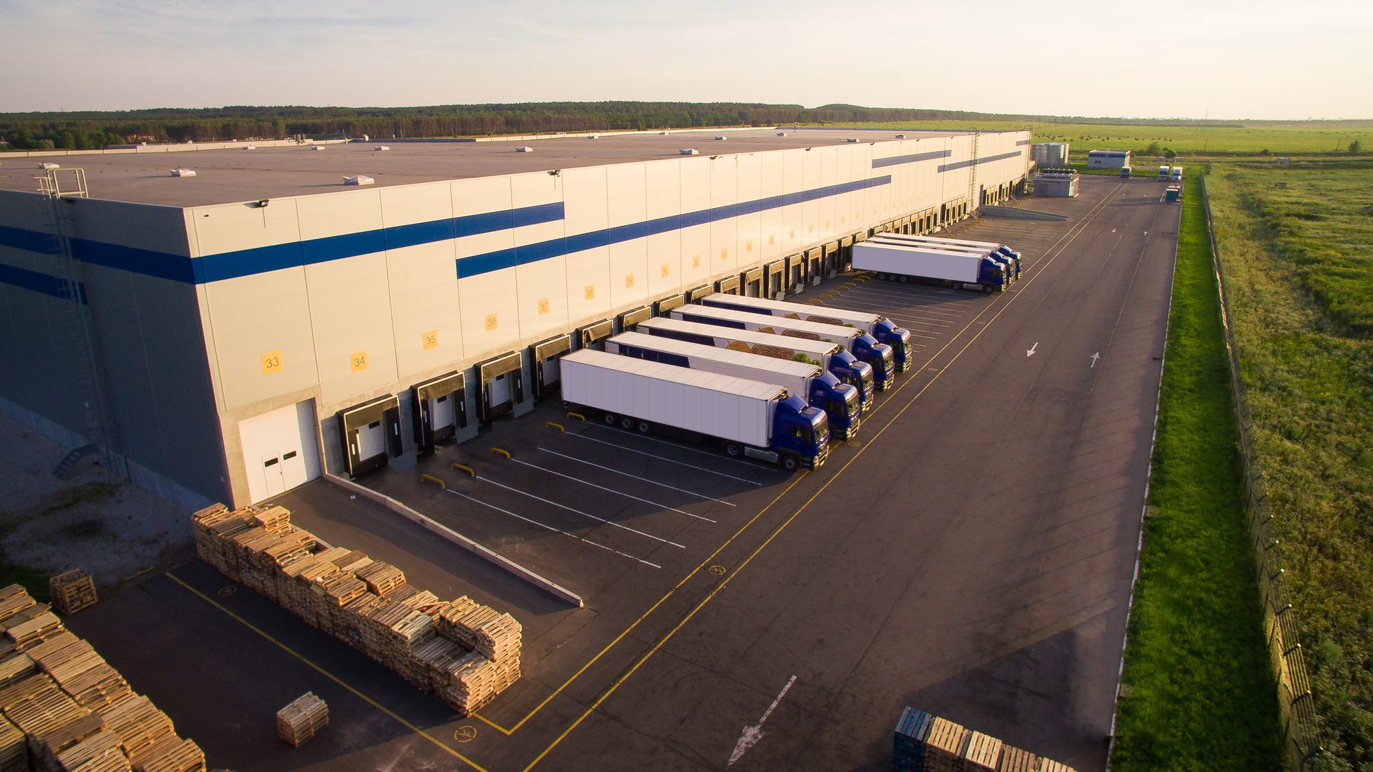 Distribution Warehouse With Trucks Of Different Capacity
