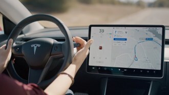 A Tesla driver engages an automation system