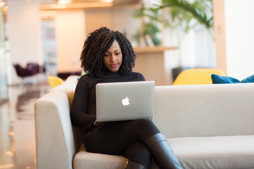 Woman filling out insurance customer service survey