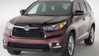 2015 Toyota Highlander in purple.
