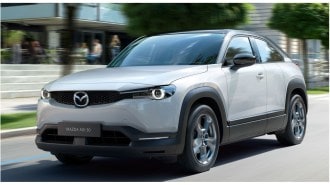 Mazda MX 30 Concept Driving Front Three Quarter