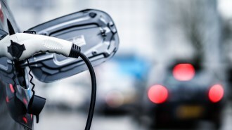 Electric vehicle with a charger attached.