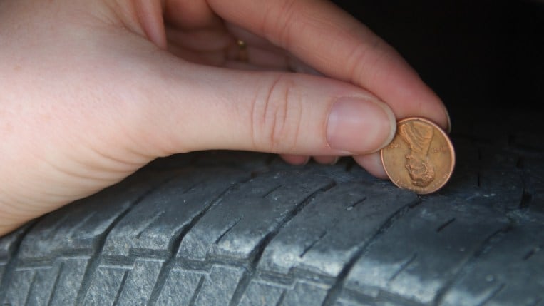 Checking a tire's tread with penny