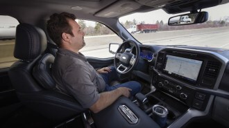 A driver tests Ford's BlueCruise hands free system