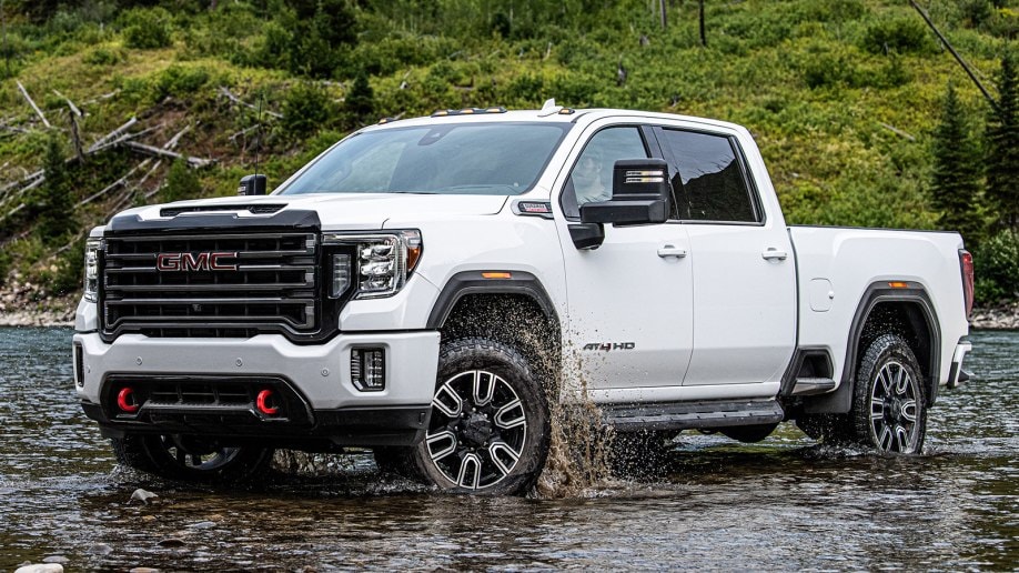 2021 GMC Sierra HD AT4 in white in a shallow river bed