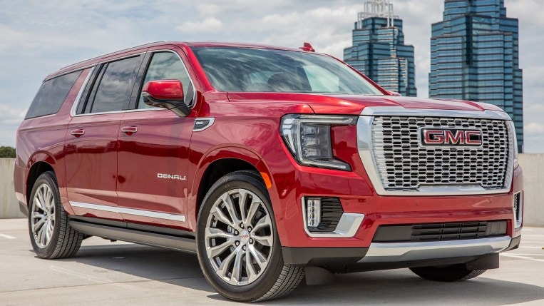 2021 GMC Yukon Denali front right side in metallic red