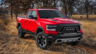 2021 RAM 1500 Rebel in red in the woods