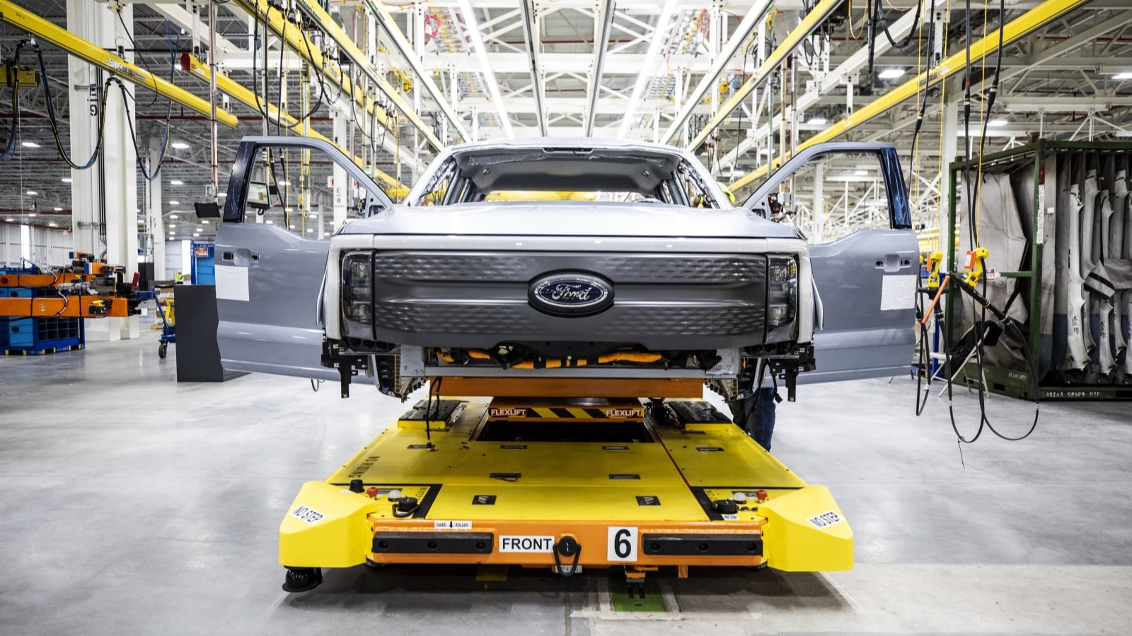 A Ford F-150 Lightning under construction on an assembly line