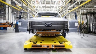 A Ford F-150 Lightning under construction on an assembly line