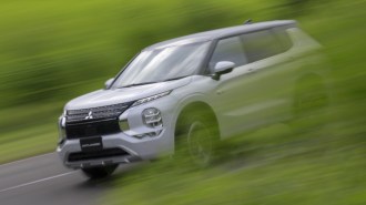 2023 Mitsubishi Outlander PHEV Driving Front Three Quarter